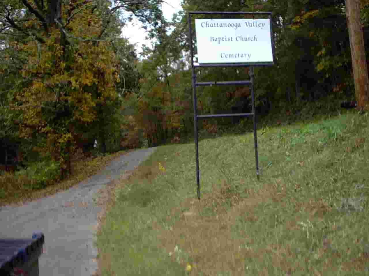 Chattanooga Valley Baptist Church Cemetery sign at the entrance to the forest